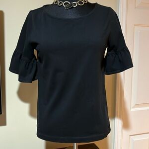 JCrew black shirt with ruffle sleeves.